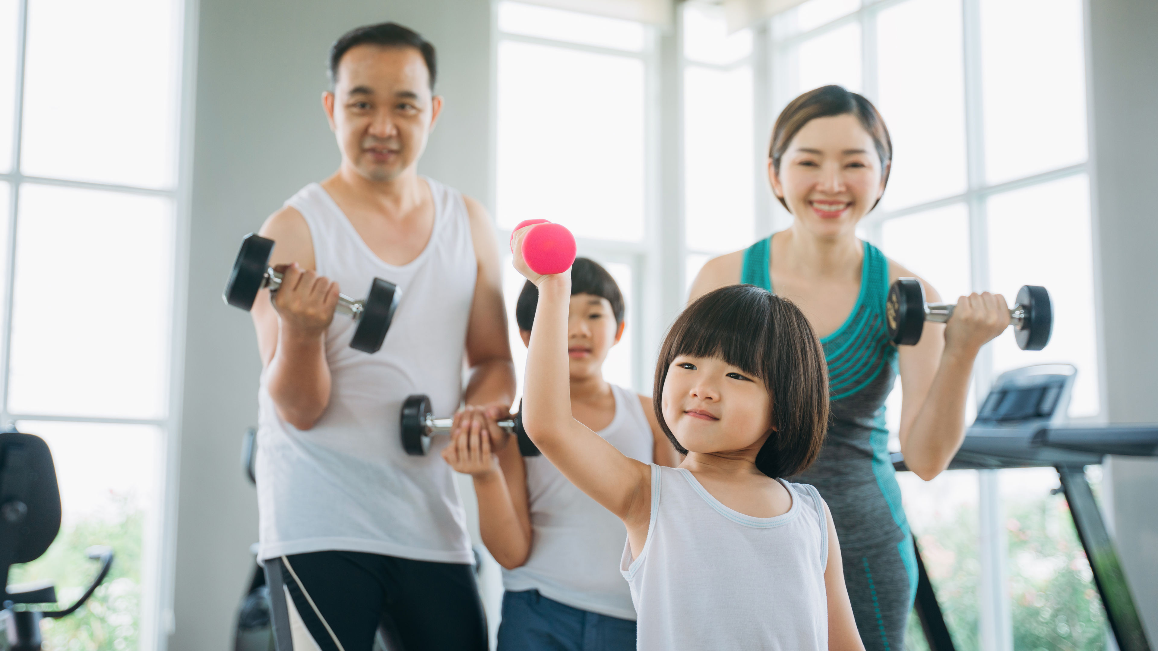A family of four doing workout