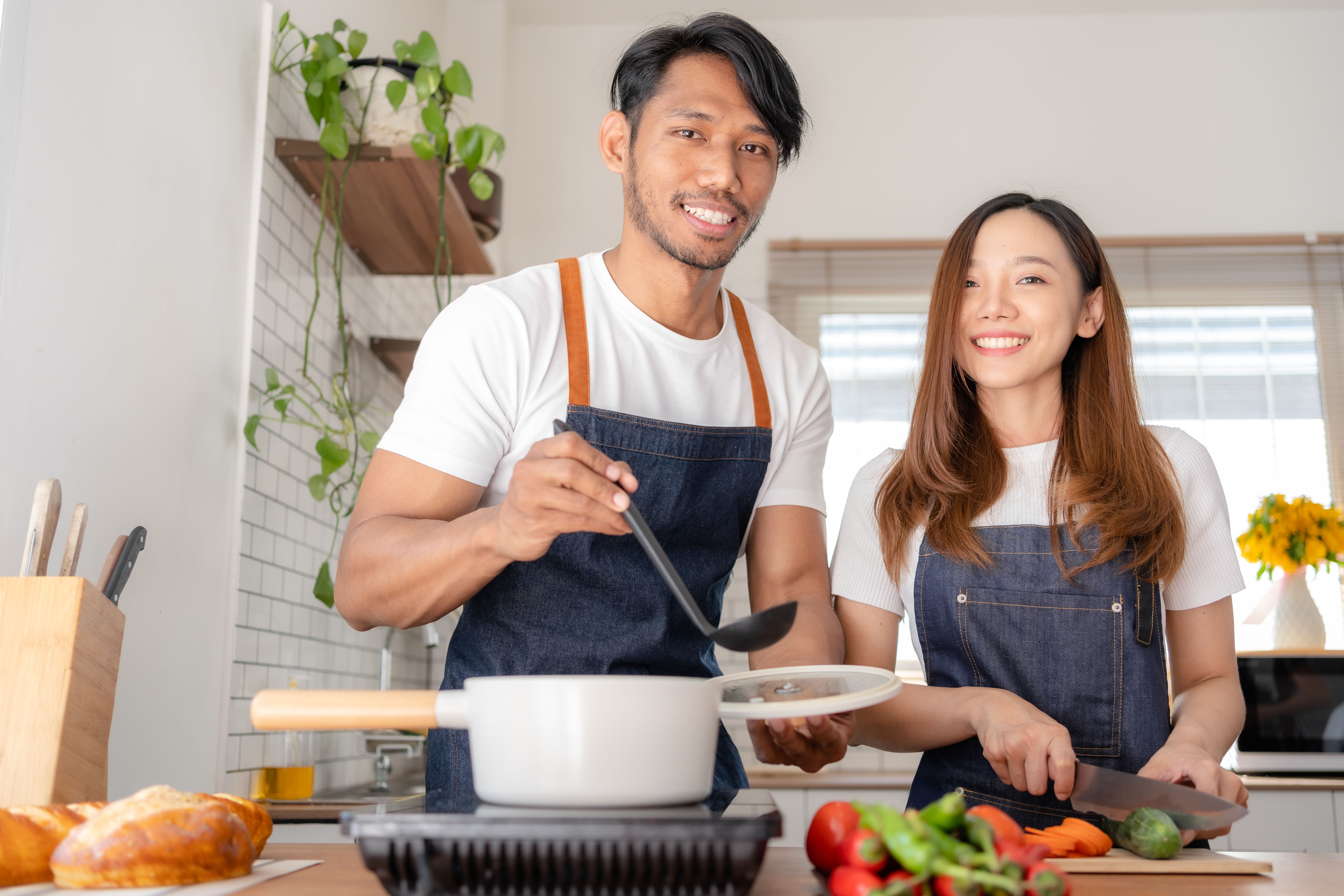 Happy couple cooking together