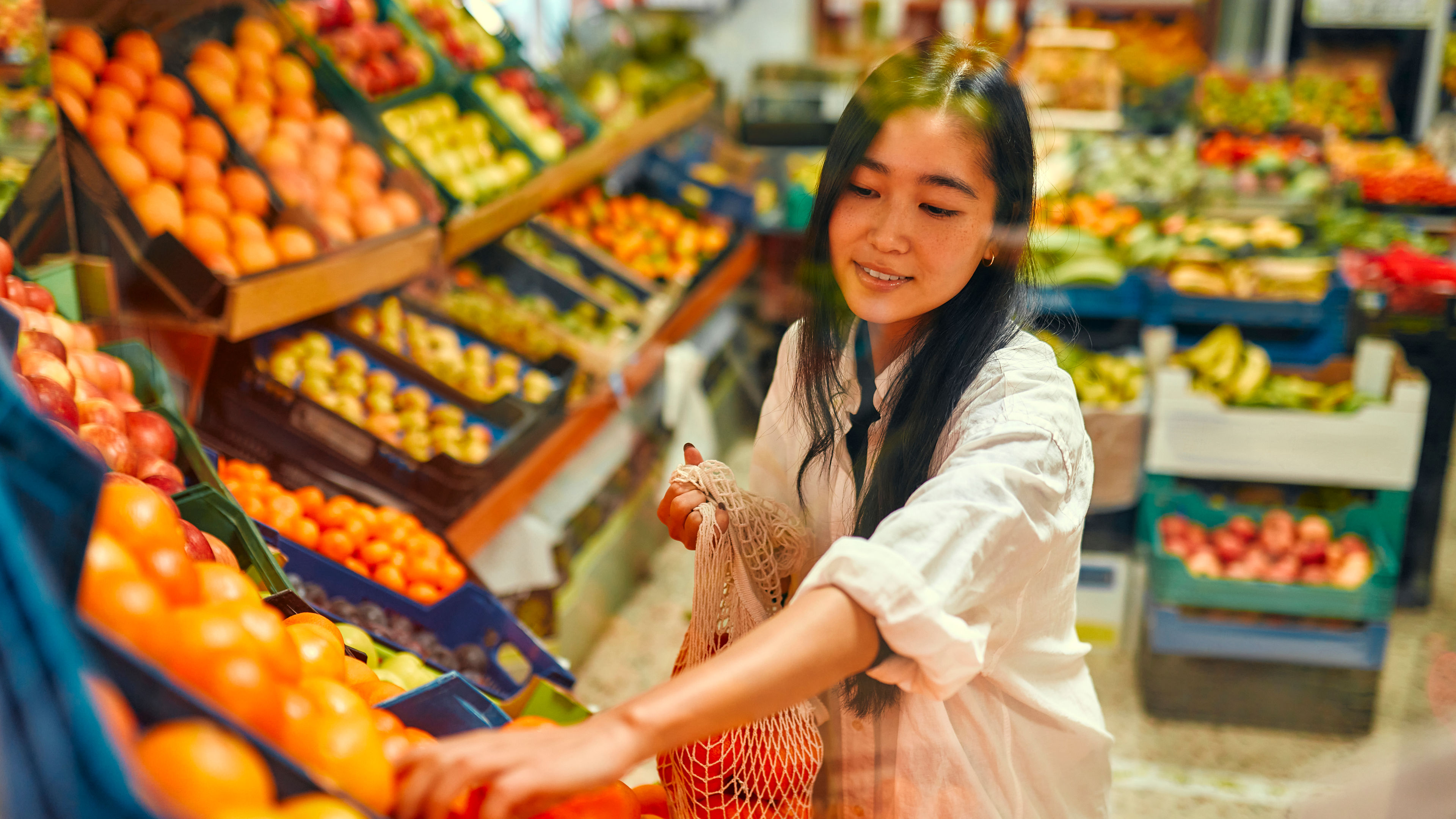 Lady at the fruit and vegetable store