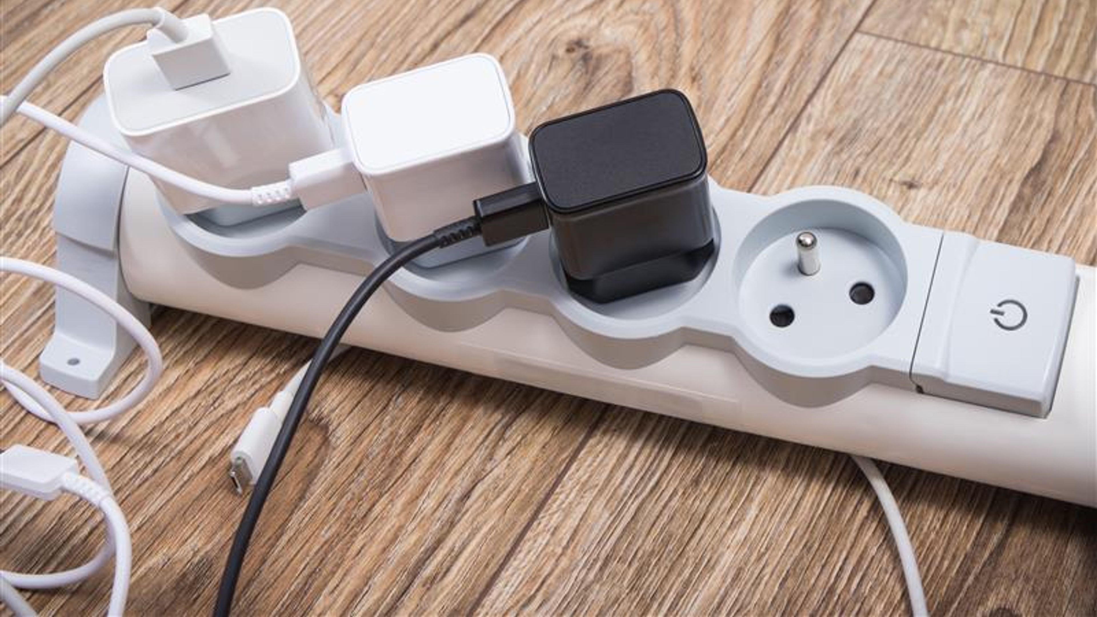 Smartphone chargers connected to electrical power strip
