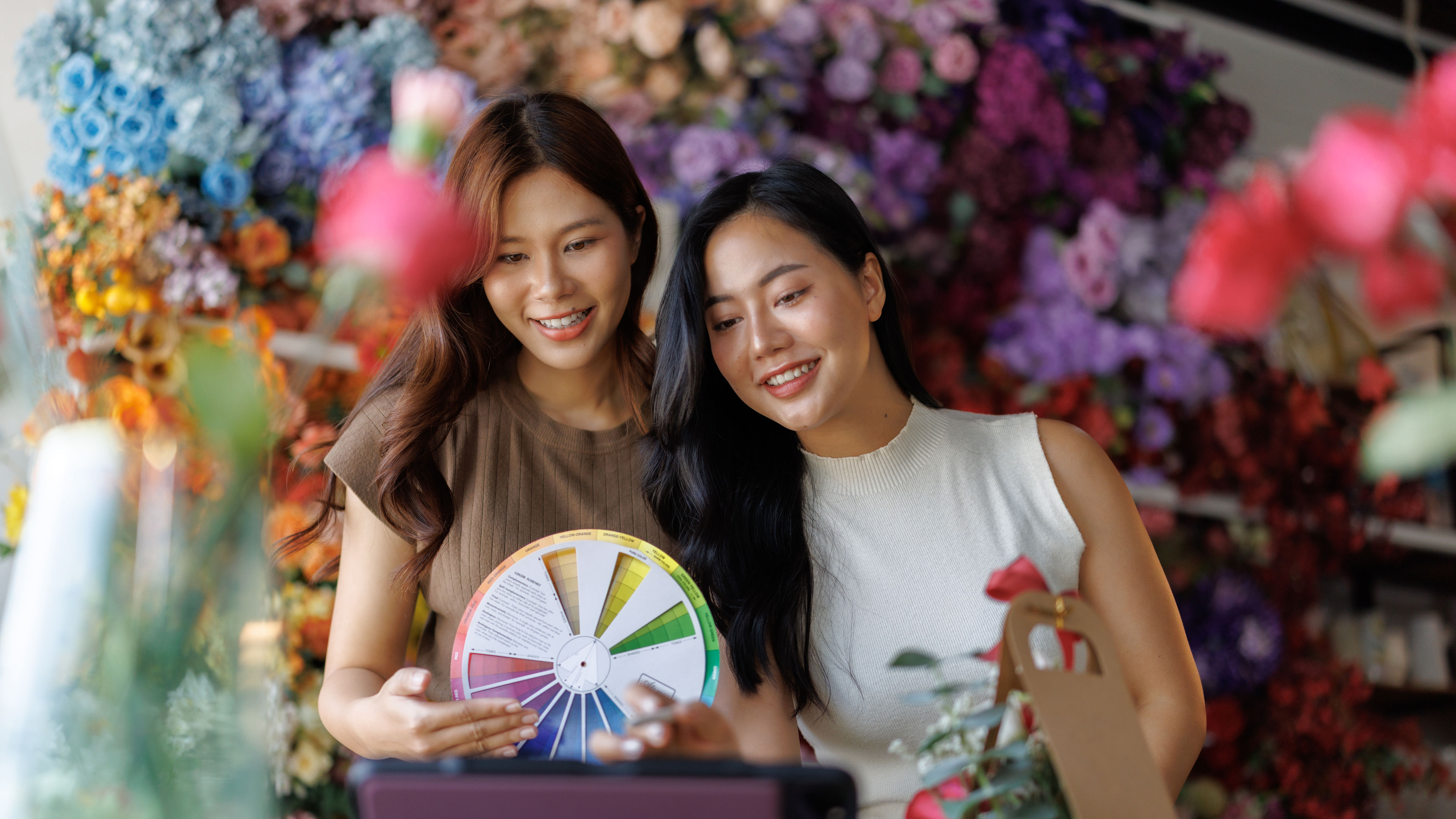 Smiling Women Creating Floral Arrangement