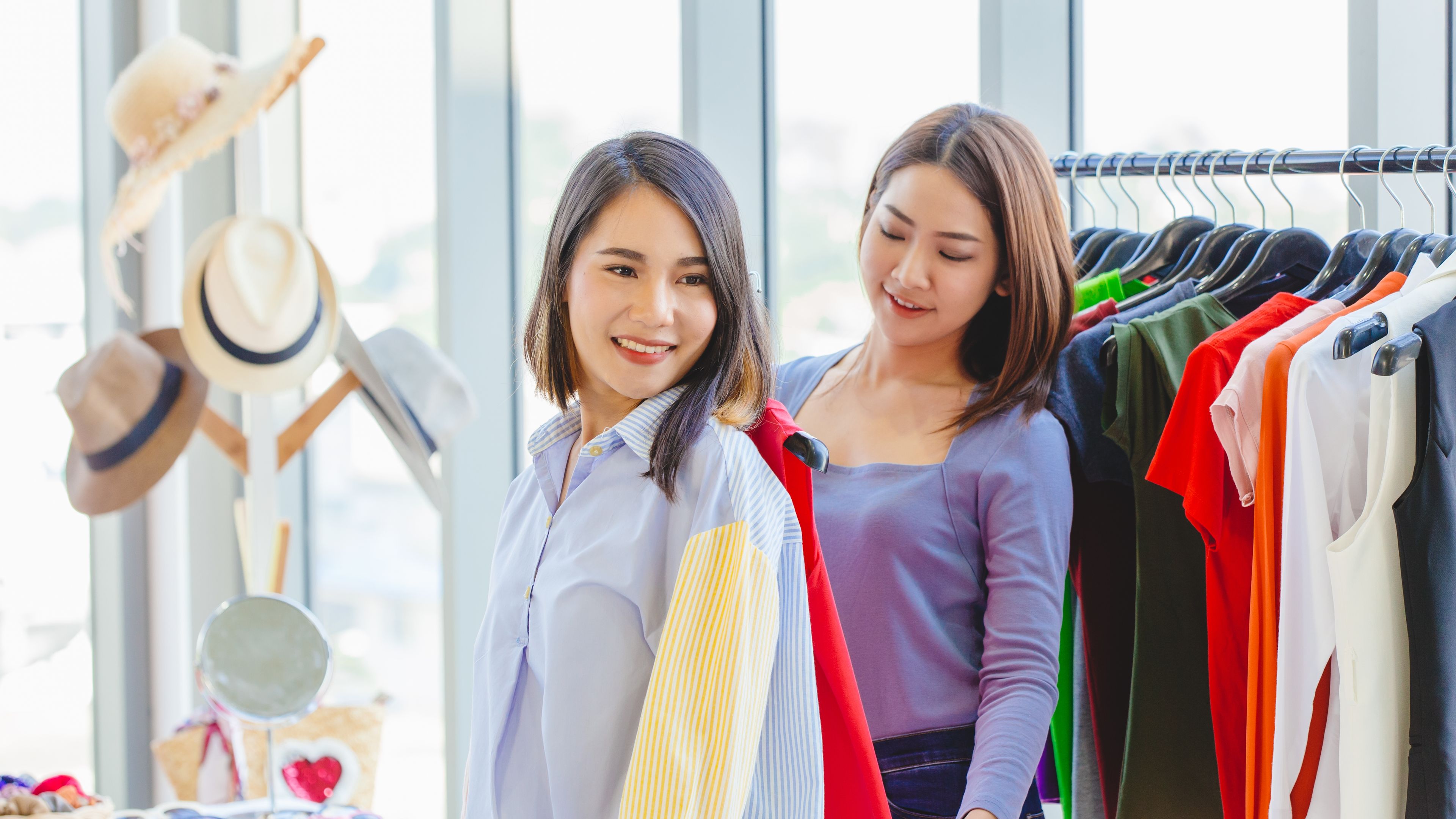 Two woman in a clothing store 
