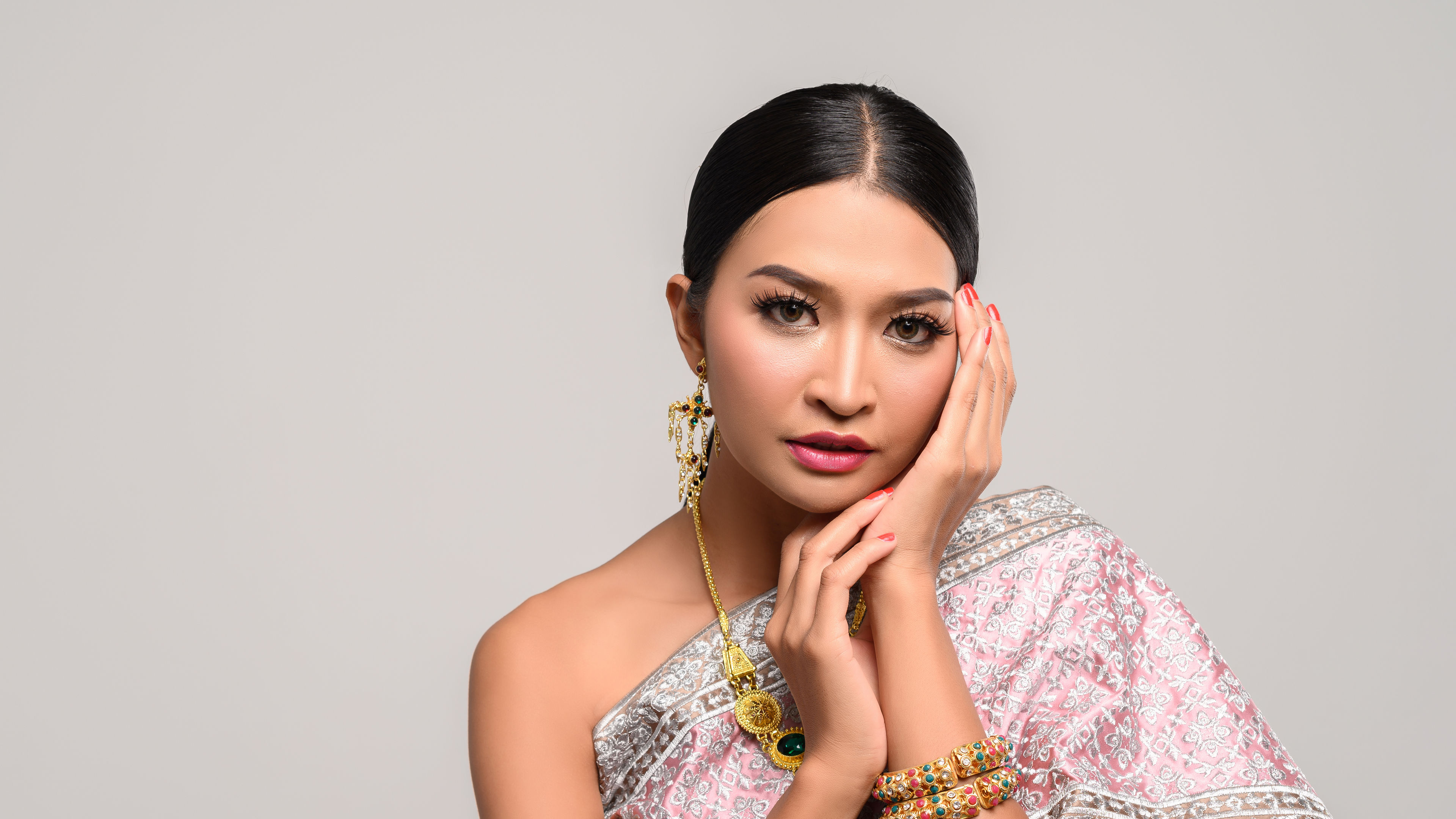 Woman Posing with Traditional Dress and Jewelery