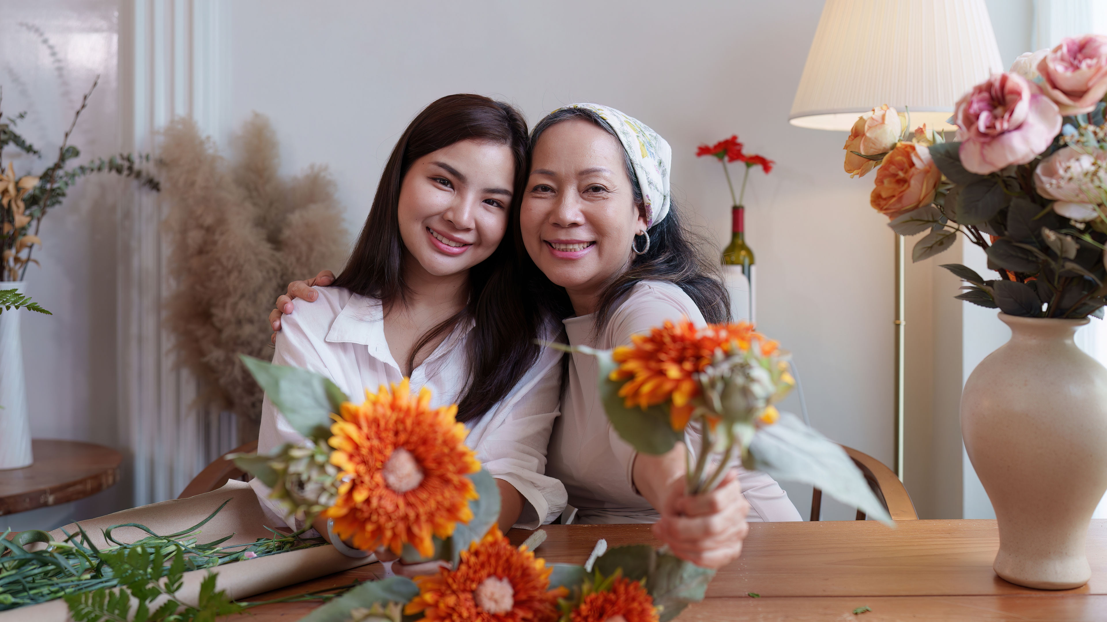 Young and older woman florist
