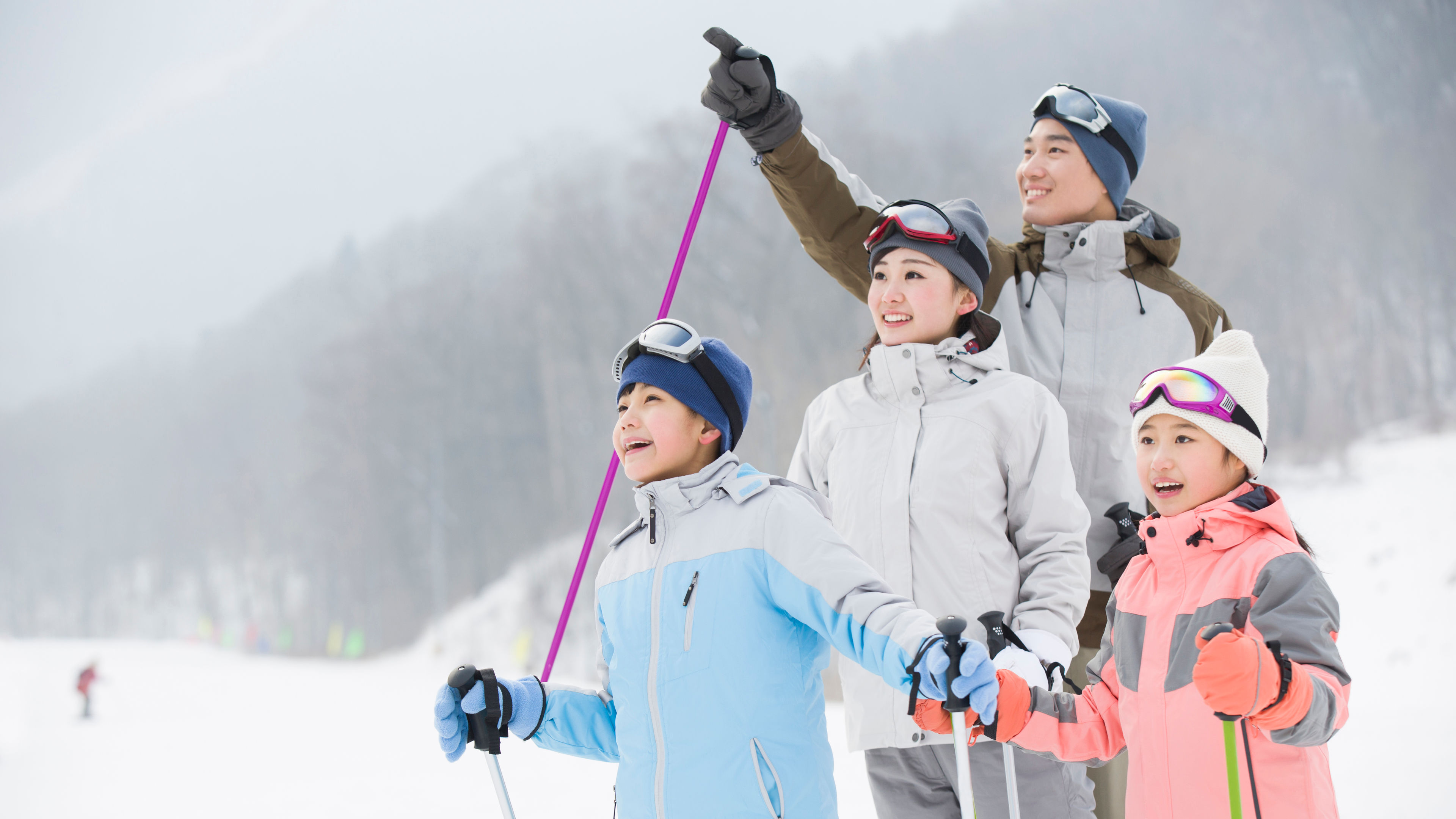 young family in ski resort 